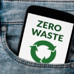 Zero waste concept on smartphone screen in jeans pocket