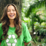 Volunteer: environmentalist wearing recycling t-shirt